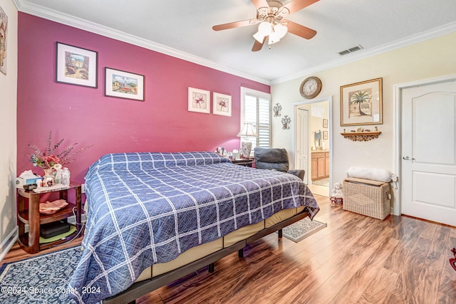 bedroom with ornamental molding, ceiling fan, hardwood / wood-style floors, and connected bathroom