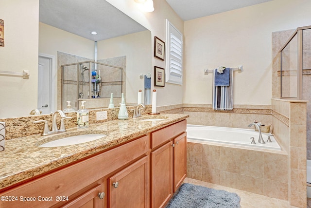 full bathroom featuring a garden tub, a sink, a shower stall, and double vanity