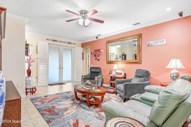 tiled living room featuring french doors, crown molding, a textured ceiling, and ceiling fan