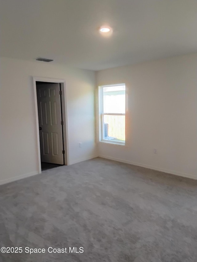 view of carpeted spare room