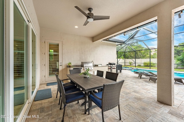 view of patio / terrace with a fenced in pool, a lanai, grilling area, and ceiling fan