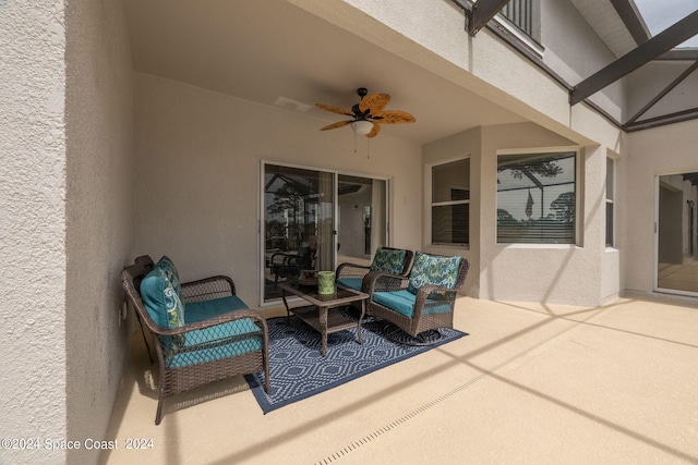 view of patio / terrace with ceiling fan and an outdoor living space