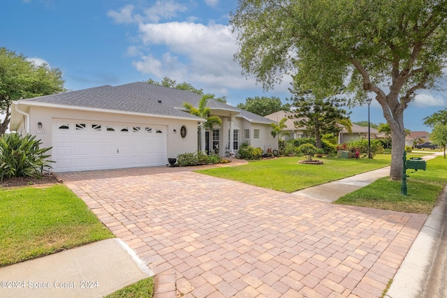 ranch-style house with a front yard and a garage