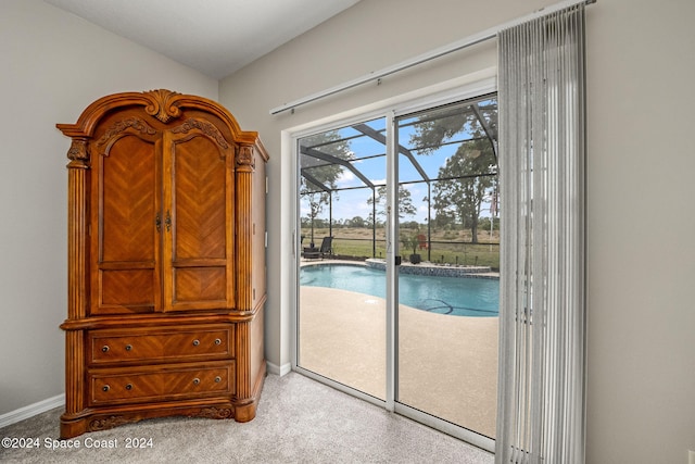 doorway to outside with light colored carpet