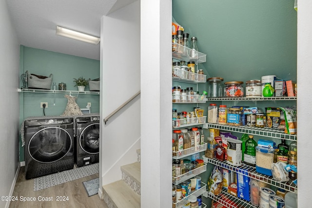 pantry featuring independent washer and dryer