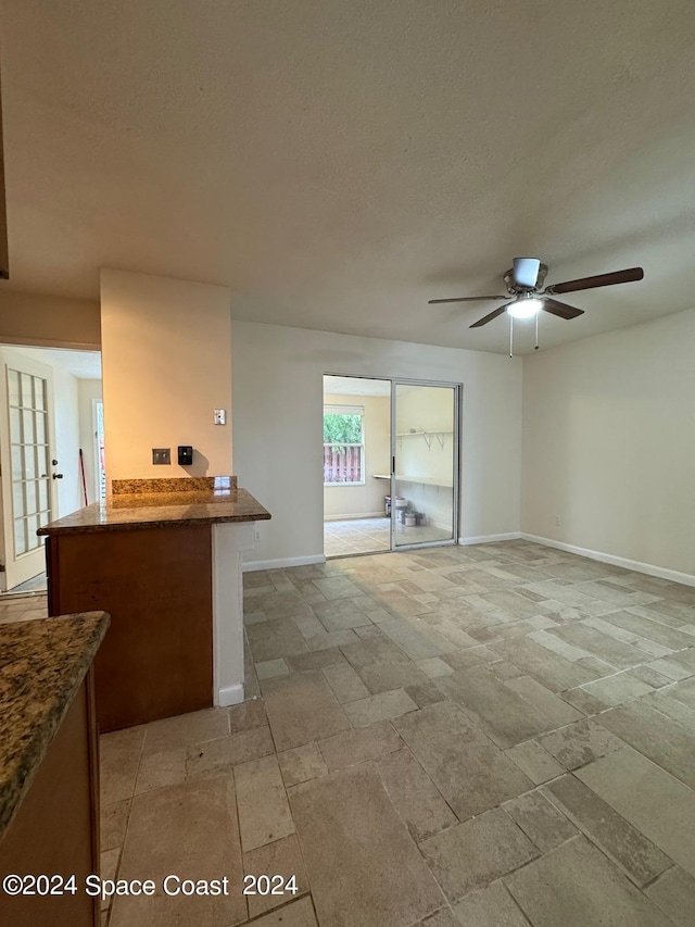 unfurnished room featuring ceiling fan