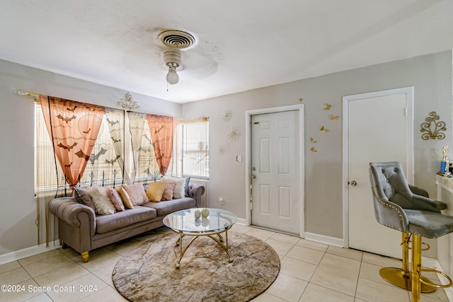 living room featuring ceiling fan and light tile patterned floors