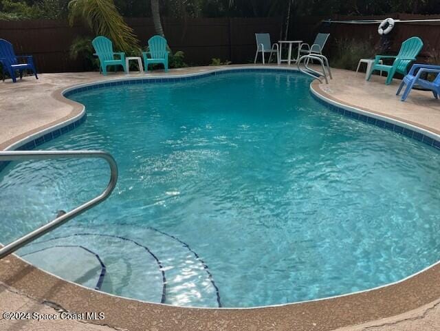 view of pool featuring a patio