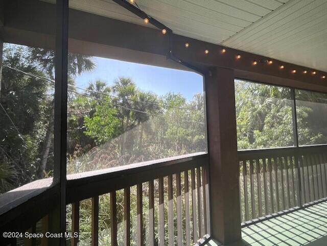 unfurnished sunroom featuring a wealth of natural light