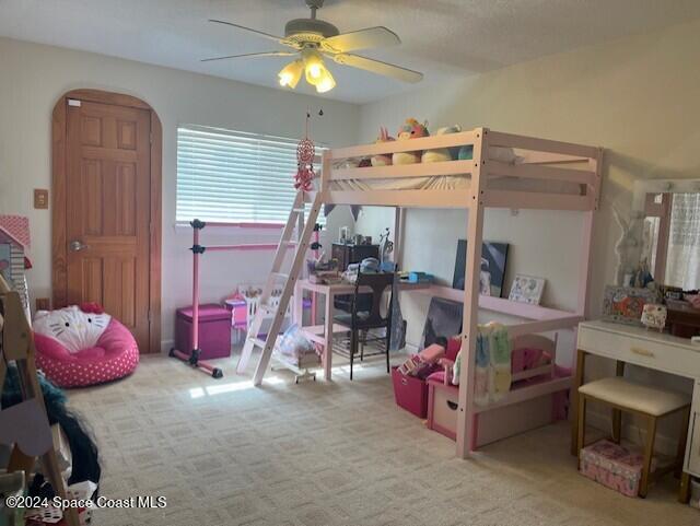 bedroom featuring ceiling fan and light colored carpet