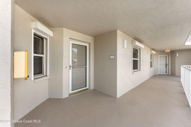 property entrance featuring a patio