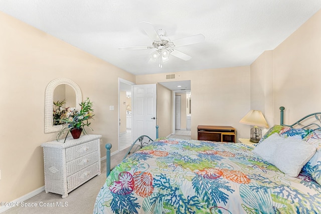 bedroom featuring a textured ceiling, carpet flooring, and ceiling fan