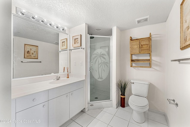 bathroom featuring vanity, toilet, a textured ceiling, and an enclosed shower