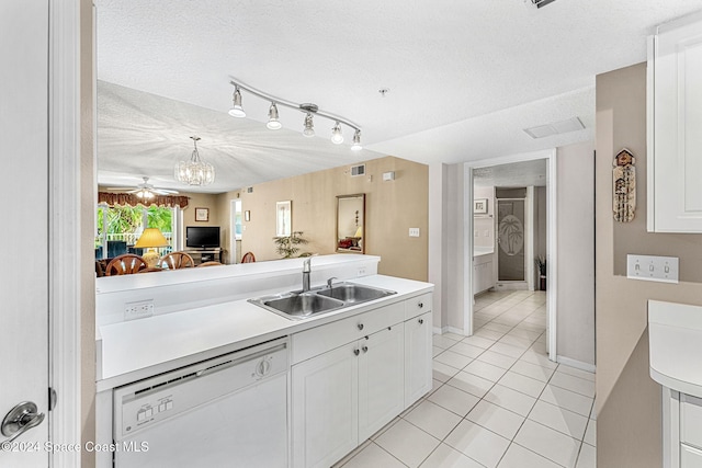 kitchen with a textured ceiling, white cabinets, sink, and white dishwasher