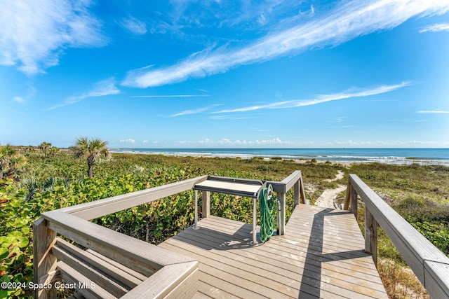 view of community with a view of the beach and a water view