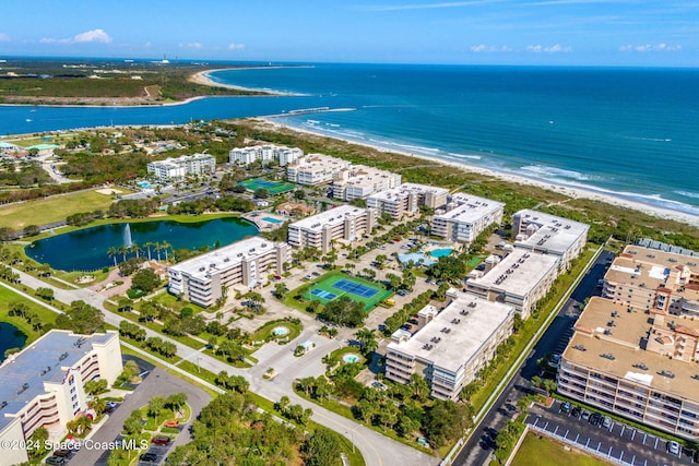 aerial view with a water view and a beach view