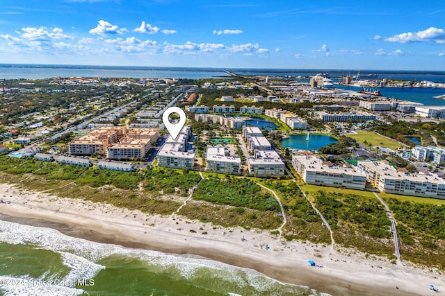 aerial view featuring a water view and a beach view