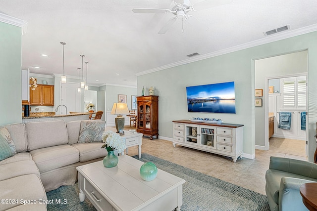 living room with crown molding, light tile patterned floors, and ceiling fan