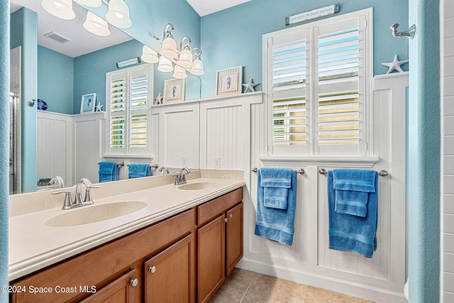 bathroom with vanity and tile patterned flooring