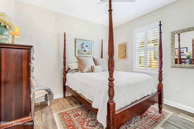 bedroom with hardwood / wood-style floors and ceiling fan