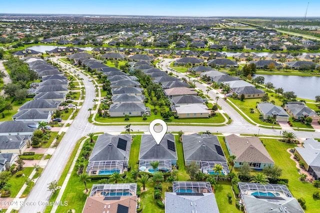 drone / aerial view with a water view