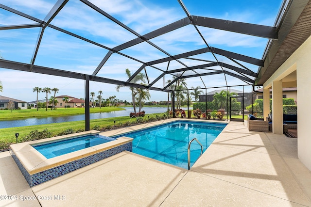 view of swimming pool with glass enclosure, an in ground hot tub, a patio area, and a water view