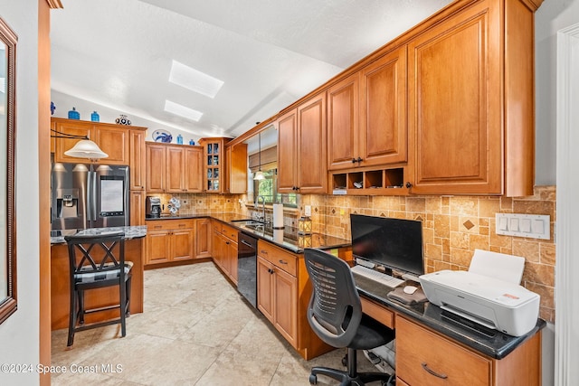 kitchen featuring lofted ceiling, black dishwasher, a breakfast bar area, pendant lighting, and stainless steel refrigerator with ice dispenser