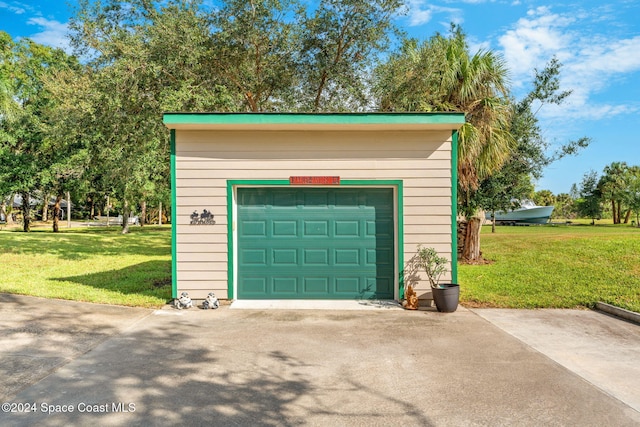 garage with a yard