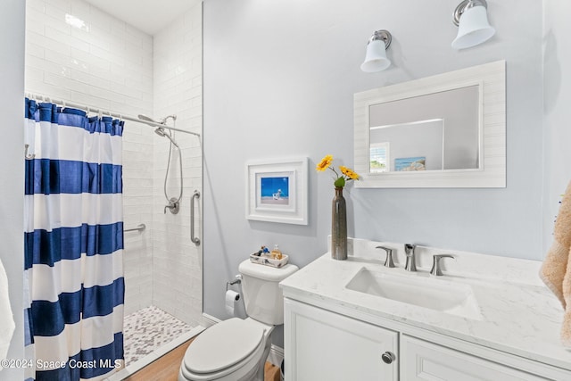 bathroom with toilet, hardwood / wood-style floors, vanity, and a shower with shower curtain