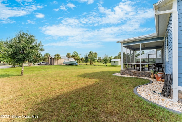 view of yard featuring a sunroom