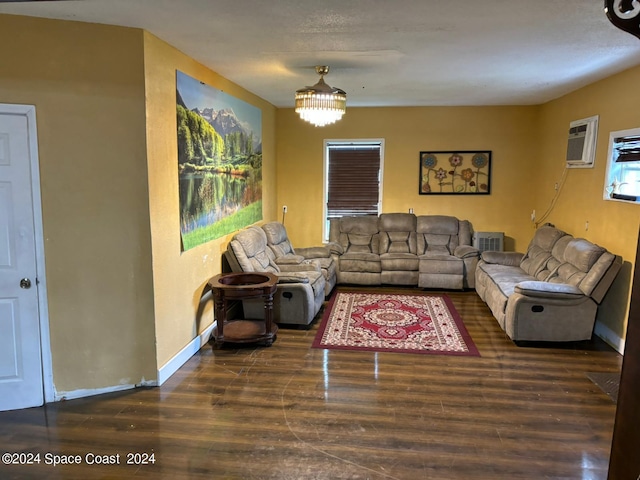 living room featuring dark wood-type flooring and an AC wall unit