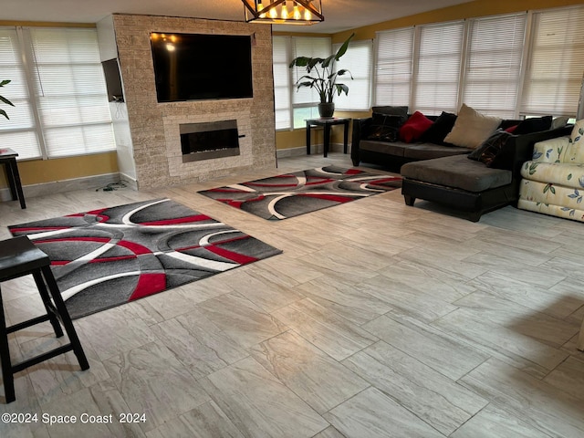 living room featuring a fireplace and plenty of natural light