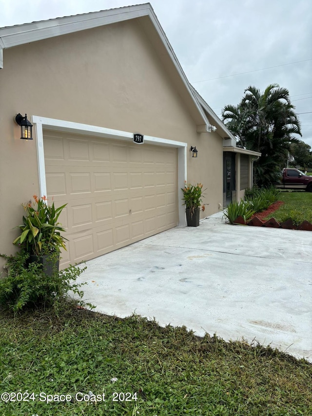 view of side of property featuring a garage