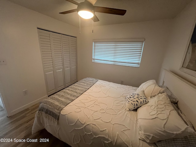 bedroom featuring a closet, hardwood / wood-style floors, and ceiling fan