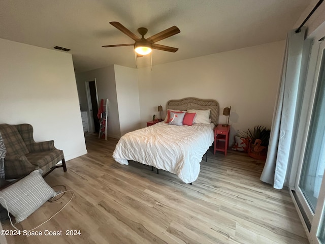 bedroom featuring light wood-type flooring and ceiling fan