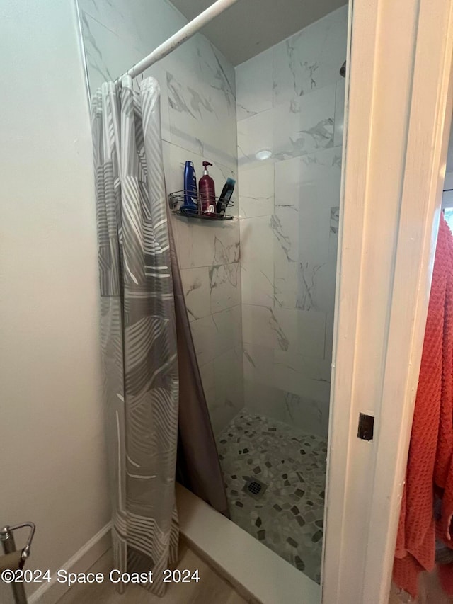 bathroom with a shower with curtain