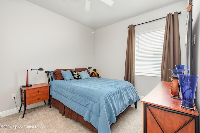 bedroom with light colored carpet and ceiling fan