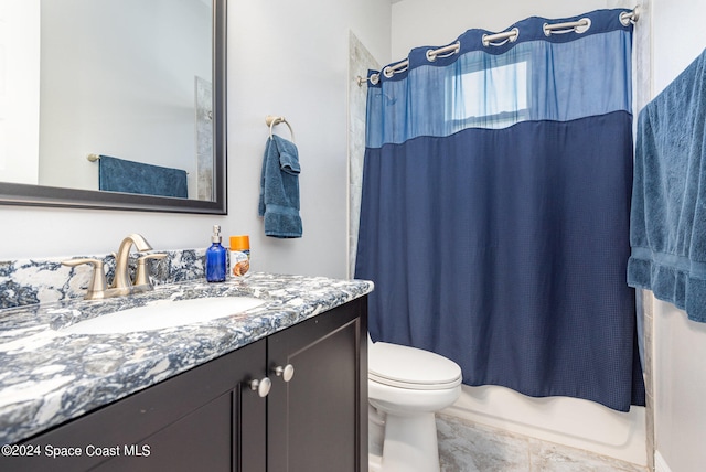 full bathroom featuring vanity, toilet, and shower / bath combo with shower curtain