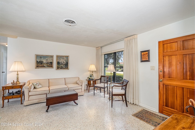 living room with a textured ceiling