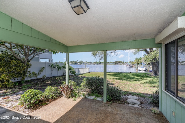 view of patio featuring a water view