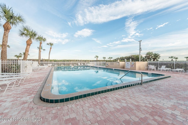 view of swimming pool featuring a patio