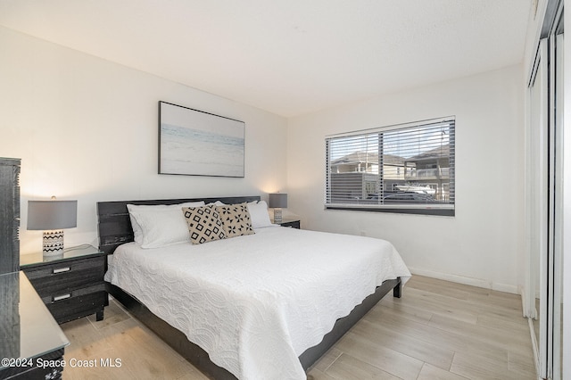 bedroom with light wood-type flooring