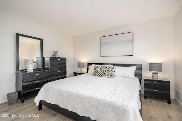 bedroom with light wood-type flooring