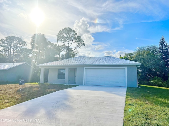 single story home with a garage and a front yard