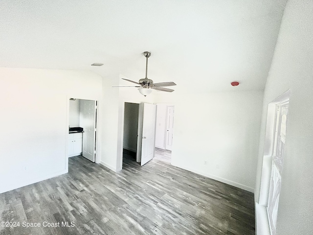 spare room featuring ceiling fan, light hardwood / wood-style floors, and lofted ceiling