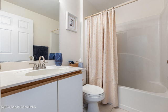 full bathroom with vanity, shower / bath combo, toilet, and tile patterned floors