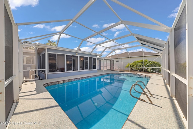 view of swimming pool featuring a sunroom, a patio area, and a lanai