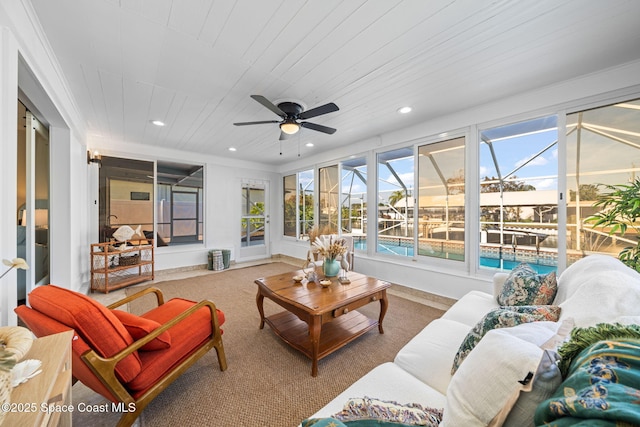 sunroom / solarium with wood ceiling and ceiling fan