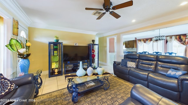 living room featuring ceiling fan, crown molding, and light tile patterned floors