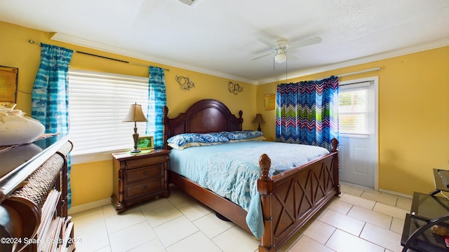 tiled bedroom featuring ornamental molding and ceiling fan